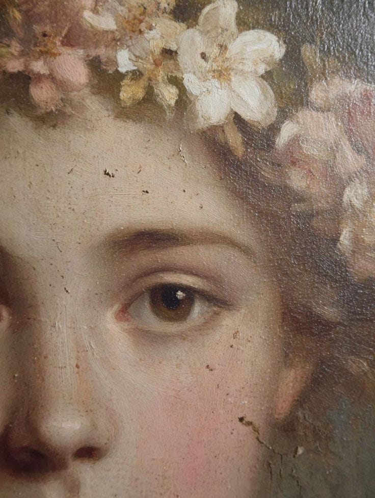 This may contain: a close up of a painting with flowers on it's head and an eye This may contain: a close up of a painting with flowers on it's head and an eye
