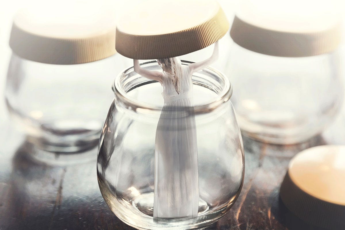 Woman Lifting Lid and Exiting Glass Bottle Woman Lifting Lid and Exiting Glass Bottle