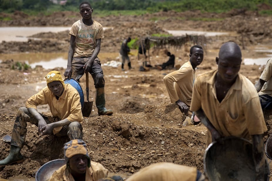 A group of young men with shovels and buckets