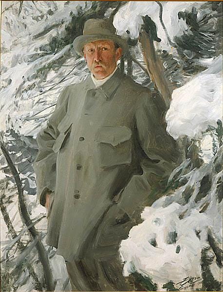 Side-by-side portraits from 1906 depicting two renowned Swedish artists painted by each other. Left: “Bruno Liljefors” by Anders Zorn shows the wildlife painter standing outdoors in a snowy forest, dressed in a pale green overcoat and hat, looking directly at the viewer with a composed but alert expression. Snow-laden branches frame him closely. Right: “Anders Zorn” by Bruno Liljefors portrays Zorn in a striking red three-piece suit, standing indoors before a rustic wooden wall with a small window. His stance is powerful and assertive, fists lightly clenched, with a serious, almost confrontational gaze. A green tie and white pocket square complete the bold look.