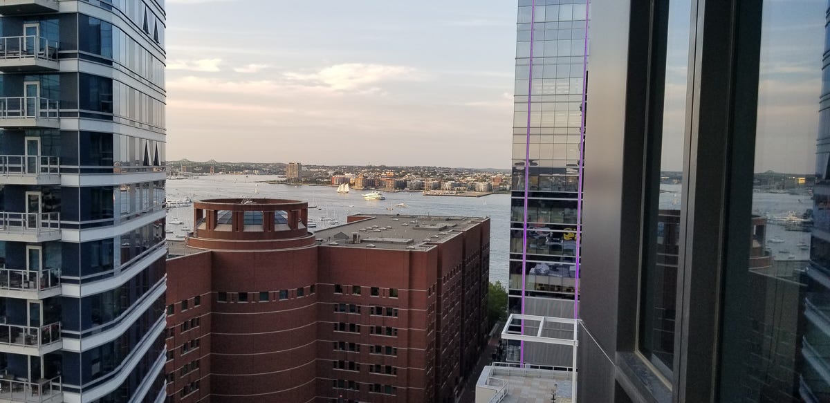 14th floor View between two buildings, peering over the Federal courhouse of Boston.