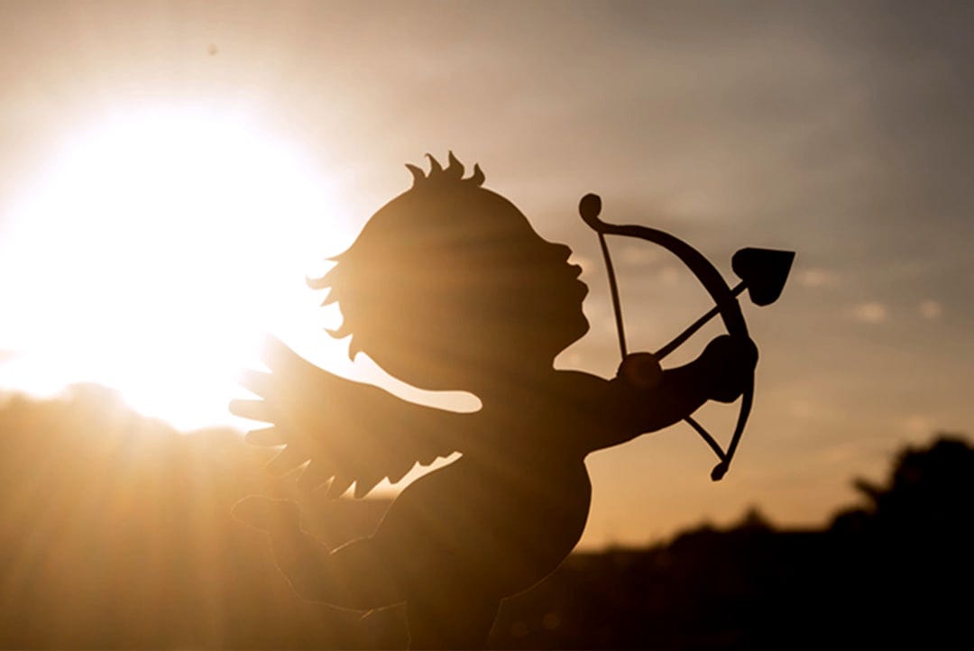 a silhouette of a cupid holding a bow and arrow