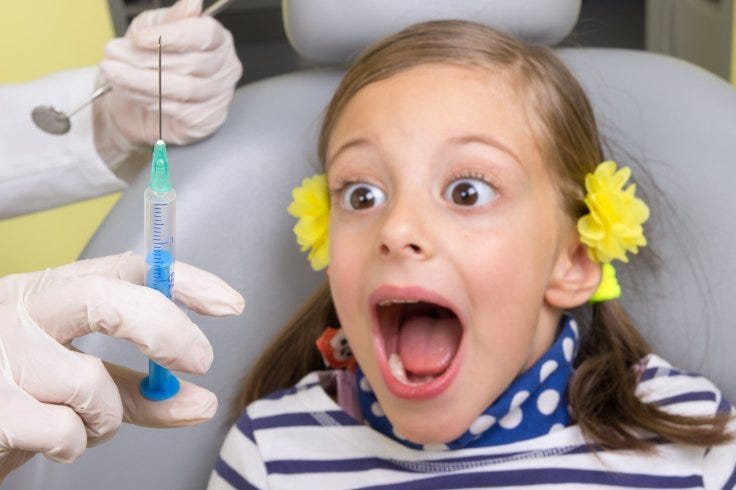Girl being put under anesthesia for dentist procedure