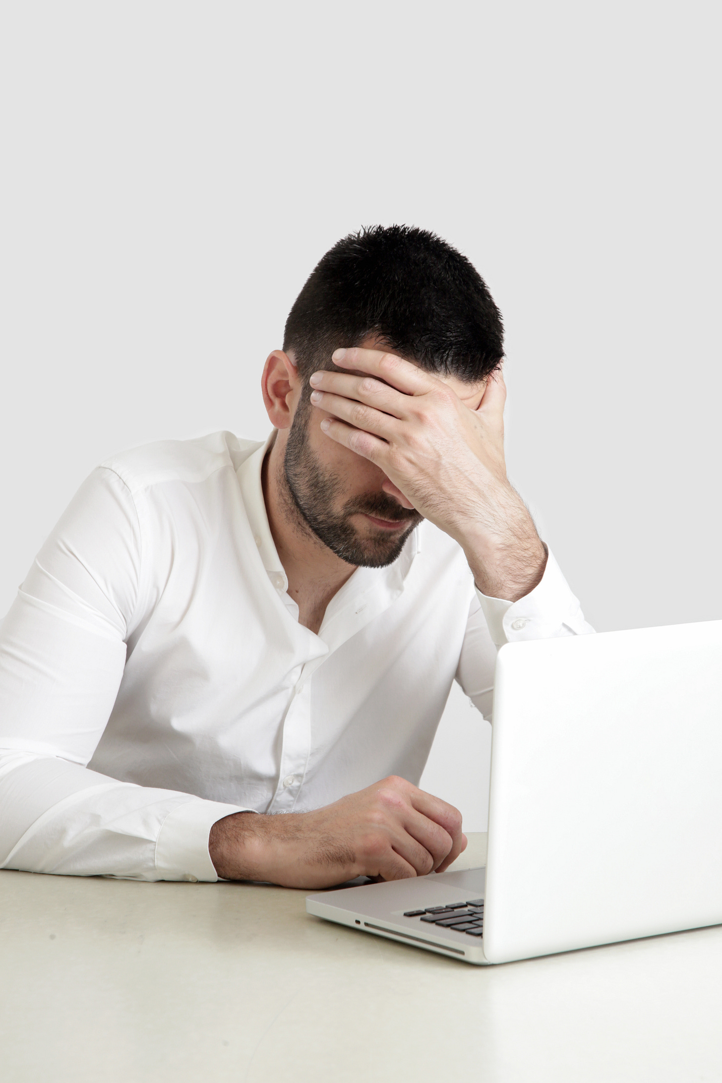 A despairing writer stares at a blank screen