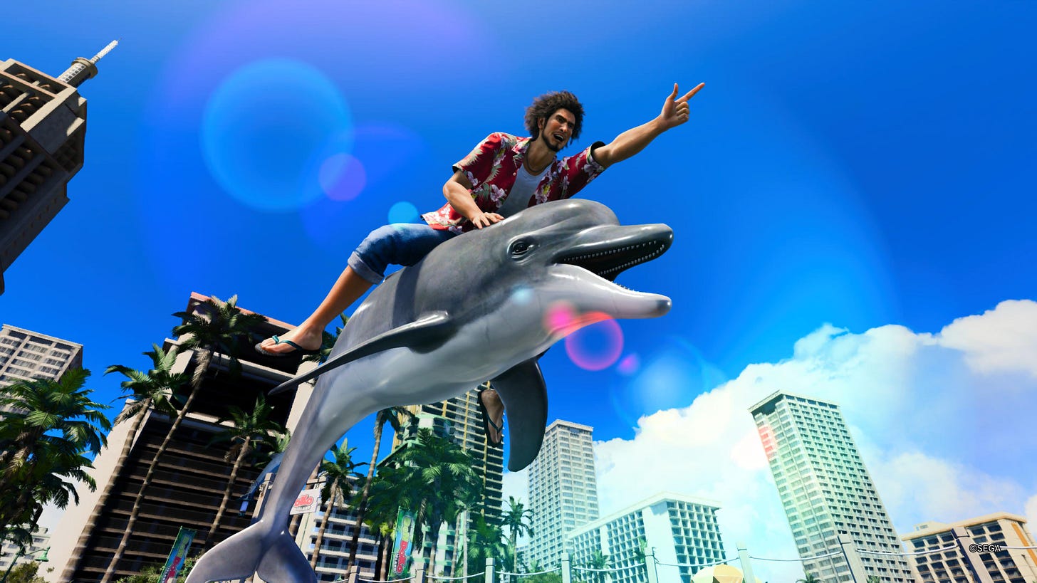 Ichiban riding a dolphin as he points forward.