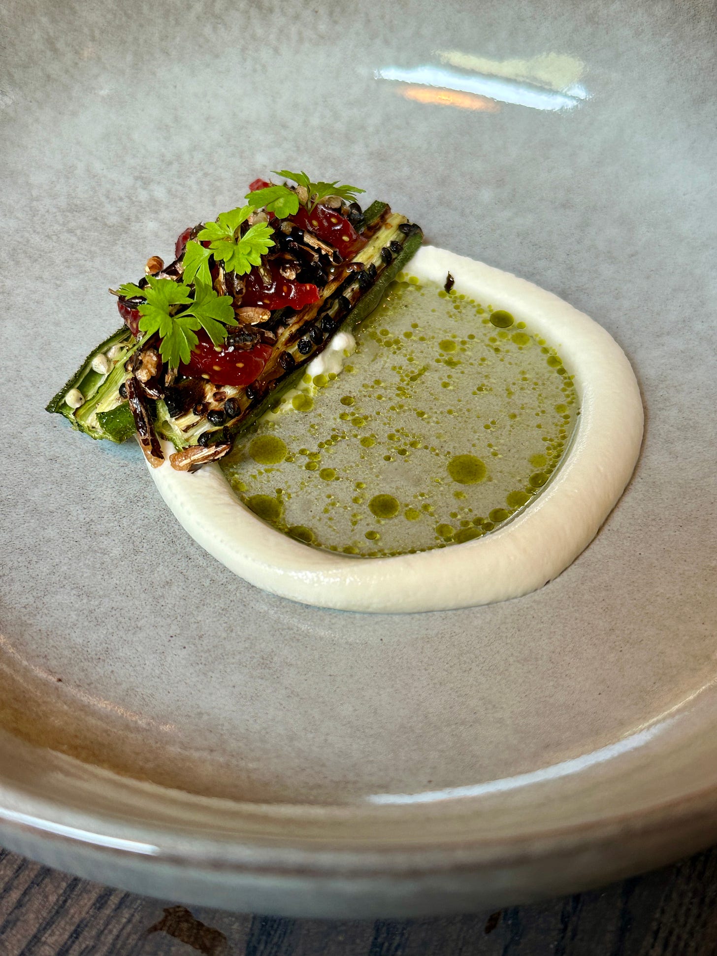 Chargrilled okra with goats cheese, watermelon and tomato at Amai by Viktor