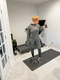 All four pictures of a woman working out, one picture doing yoga, another lifting weights, and another on the treadmill.
