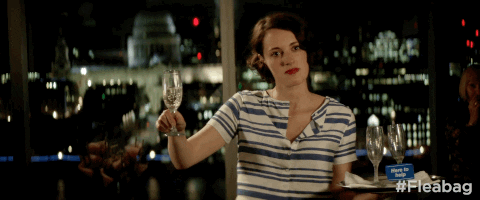Phoebe Waller-Bridge raising a champagne class in 'Fleabag'
