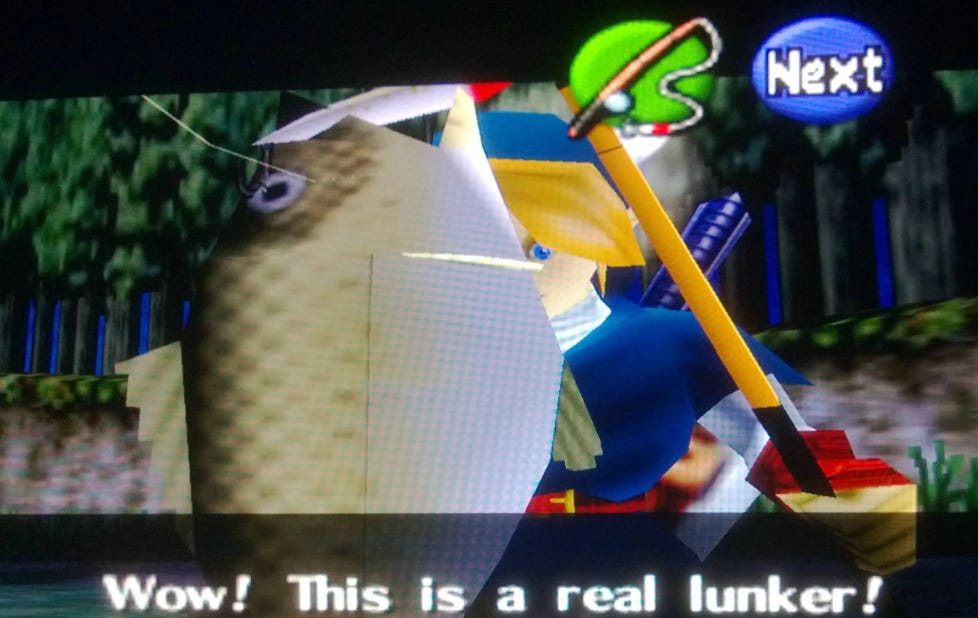fishing from Legend of Zelda: The Ocarina of Time with Link catching a big fish and the game says Wow! This is a real lunker!