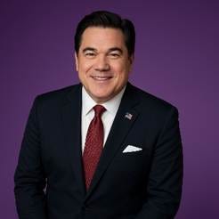 A person in a suit and tie

AI-generated content may be incorrect.