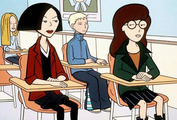 A still from "Daria," showing Jane and Daria sitting at school desks. A still from "Daria," showing Jane and Daria sitting at school desks.
