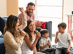 Image result for mom dad and children singing happy