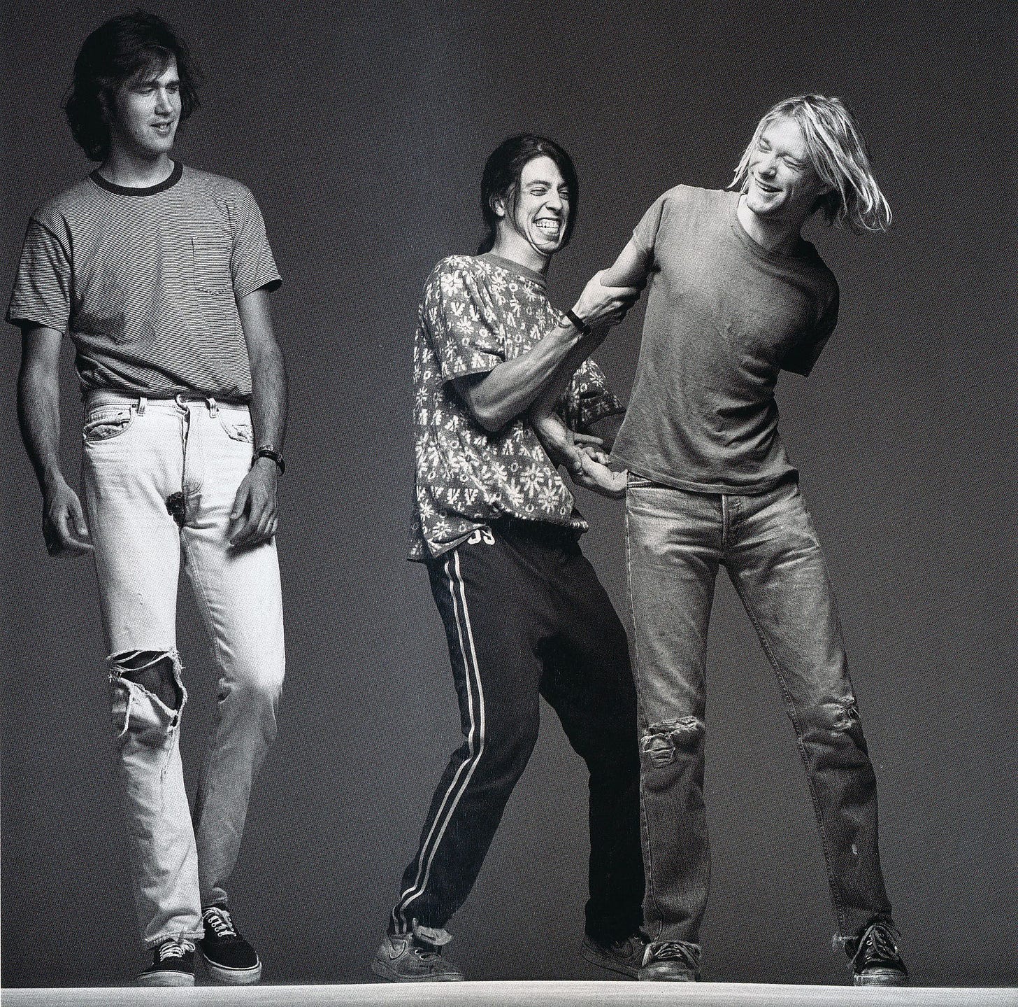 9. Nirvana, 1991. This band is great example of another trend in 90's -  grunge style. Often oversized clothes, a lot of pleads and flannel, holes  everywhere and look like they don't