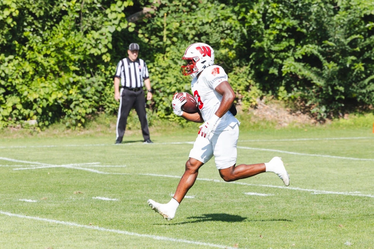 Wisconsin running back Abu Sama carries the football during a team practice. Wisconsin running back Abu Sama carries the football during a team practice.