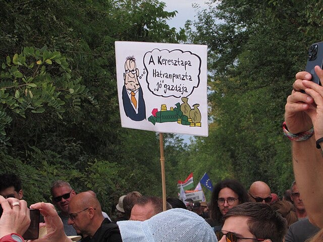 Protest sign at Hatvanpuszta estate demonstration in Hungary criticising Orbán family ownership Protest sign at Hatvanpuszta estate demonstration in Hungary criticising Orbán family ownership