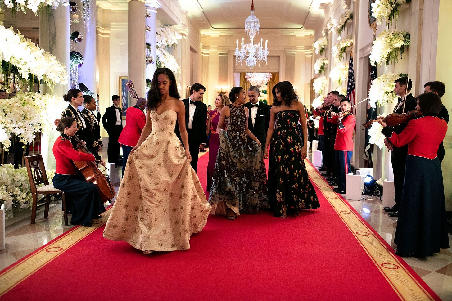 March 10, 2016: Malia and Sasha Obama, distinguished guests at the State Dinner for Canadian Prime Minister Justin Trudeau, make their way to the State Dining Room for musical entertainment, showcasing their growing presence. March 10, 2016: Malia and Sasha Obama, distinguished guests at the State Dinner for Canadian Prime Minister Justin Trudeau, make their way to the State Dining Room for musical entertainment, showcasing their growing presence.