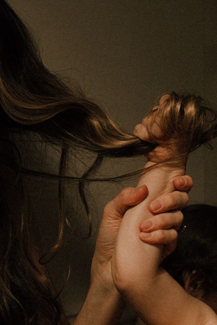 This may contain: a woman is holding her hair in the air while another person holds her hand out