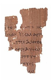 photo of a fragment of papyrus with writing on it photo of a fragment of papyrus with writing on it