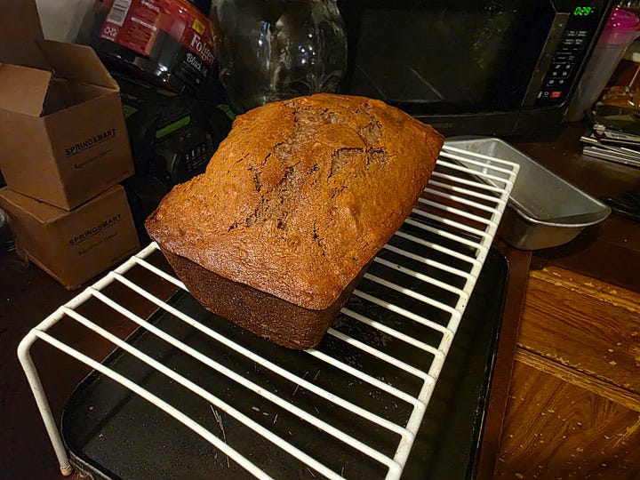two banana bread photos, on the left a loaf on a white cooling rack. On the right, a loaf wrapped in foil that's had a slice taken.