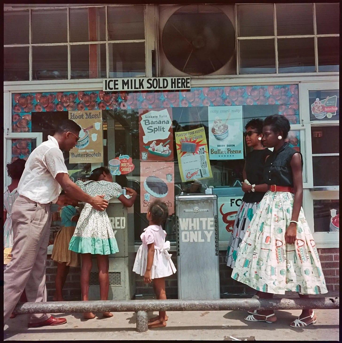 At a segregated drinking fountain, Mobile, Alabama, USA, 1956. © Gordon Parks