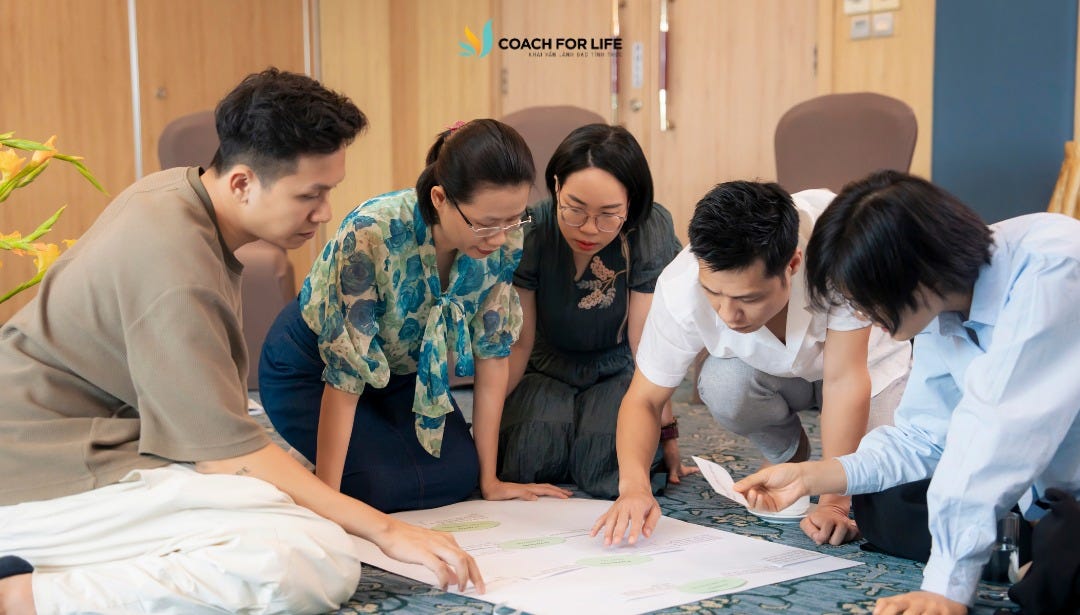 May be an image of 4 people, people studying and text