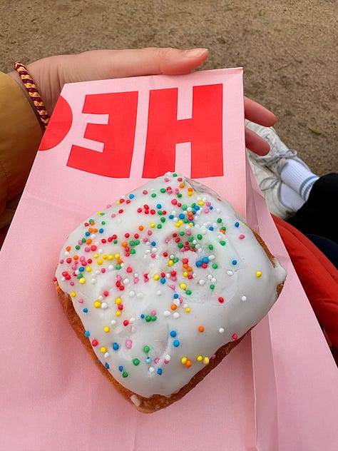 Flower artworks in the car, a sprinkle doughnut, Australianarama on screen