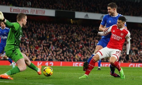 Gabriel Martinelli steers the ball past Jordan Pickford to make it 4-0 to Arsenal. 