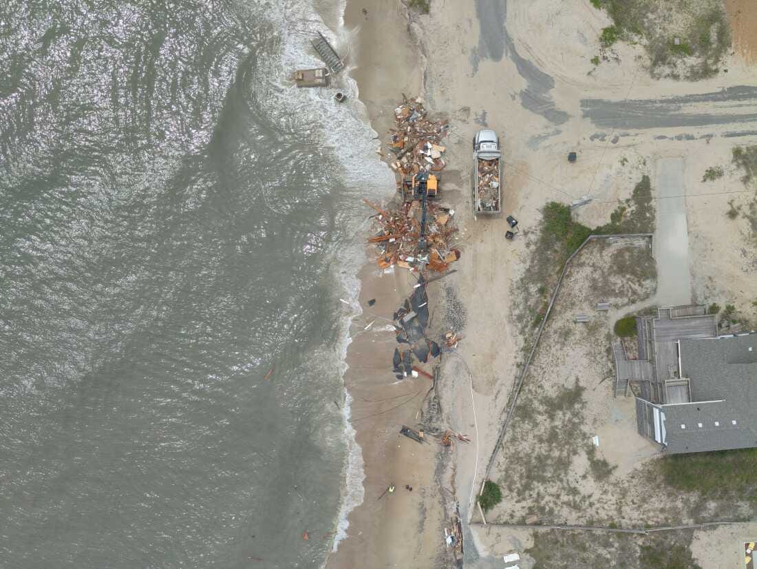 An aerial photo shows debris from a house that collapsed on May 28 in Rodanthe, N.C.