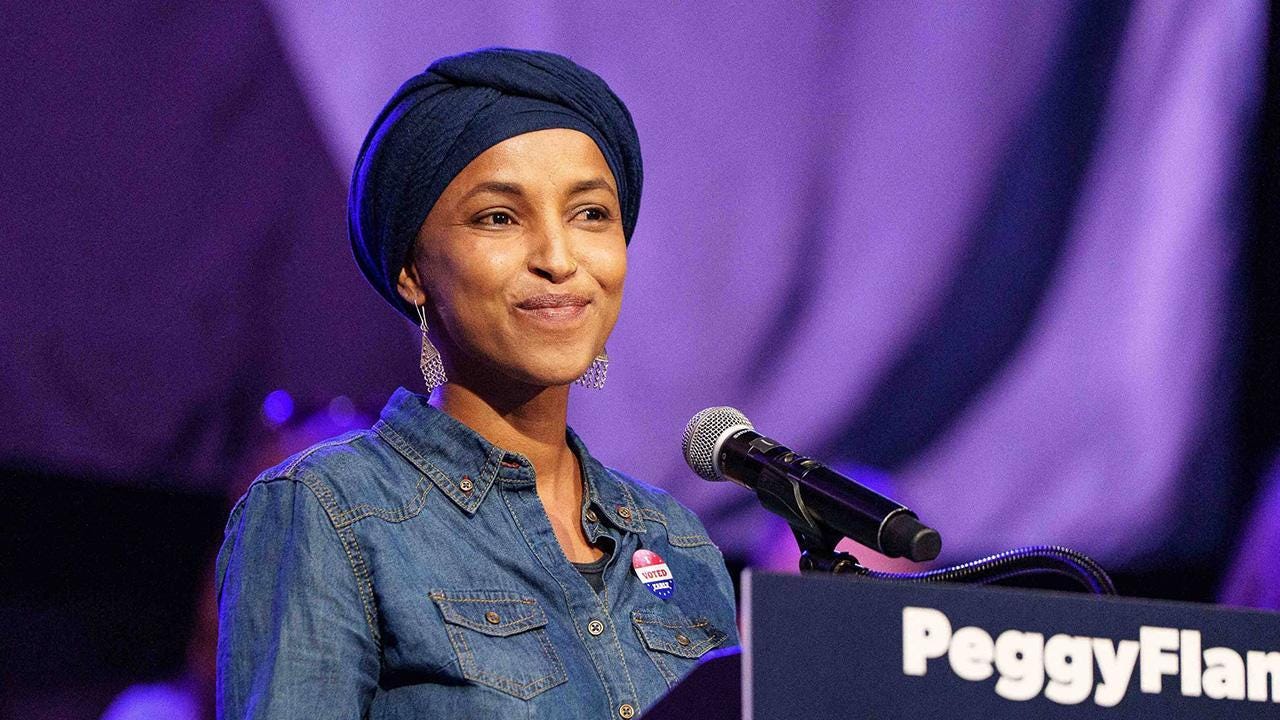 Image of a watchdog is demanding a Hatch Act investigation in the Ilhan Omar case. Image of a watchdog is demanding a Hatch Act investigation in the Ilhan Omar case.