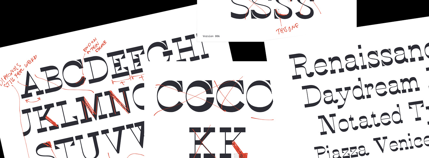 Four papers of annotated drafts spread out.