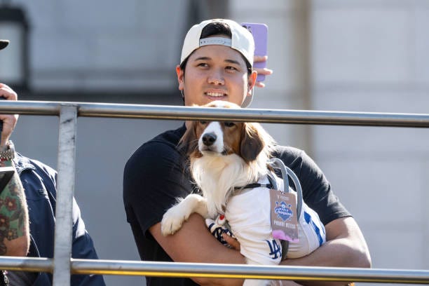 Los Angeles, CA Shohei Ohtani and his dog ride in a double-decker bus in a parade through Los Angeles to celebrate the World Championship on Friday,...