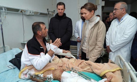 A picture released by the official Syrian Arab News Agency (Sana) shows Syria’s president, Bashar al-Assad, and first lady Asma al-Assad visiting a wounded survivor of the earthquake, that hit Turkey and Syria, at Tishreen University hospital in Latakia.