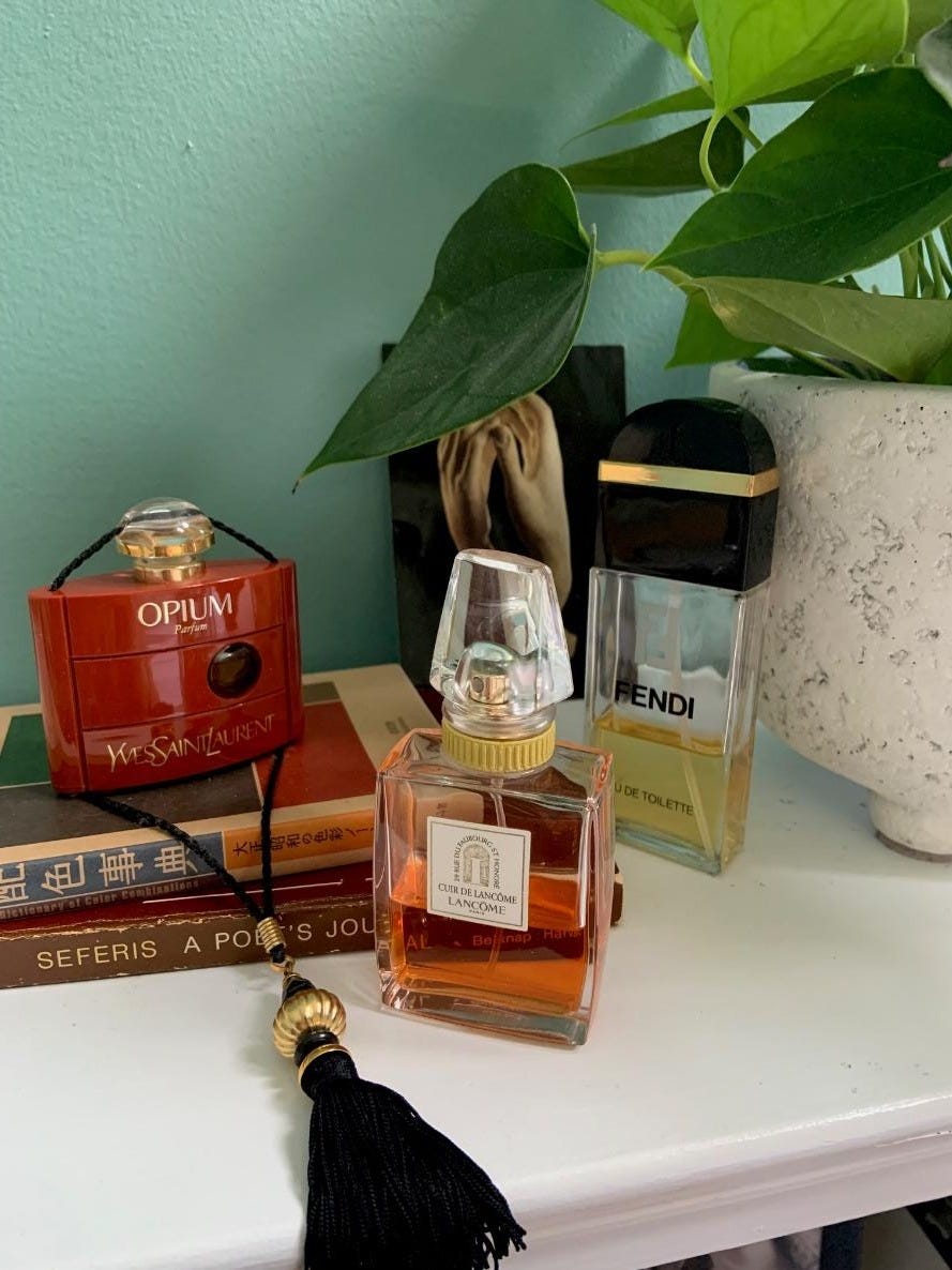 A group of perfume bottles on a shelf

Description automatically generated