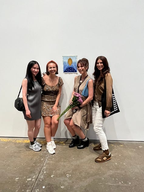 images of artists standing next to their artworks