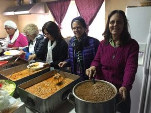 Mary Ann and Ellen serving food