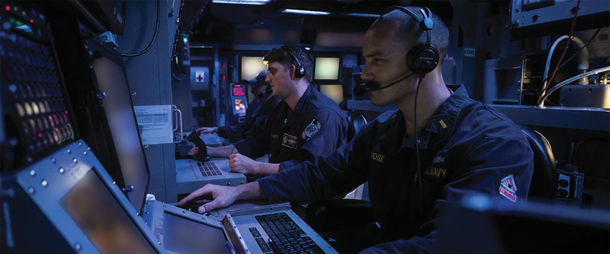 A junior officer stands watch in the combat information center on board the guided-missile destroyer USS Wayne E. Meyer (DDG-108) in the U.S. Central Command area of responsibility. A junior officer stands watch in the combat information center on board the guided-missile destroyer USS Wayne E. Meyer (DDG-108) in the U.S. Central Command area of responsibility.
