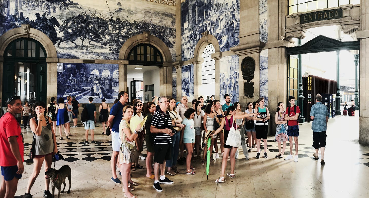 Tourists take in the breathtaking azulejos in Sao Bento Station Tourists take in the breathtaking azulejos in Sao Bento Station