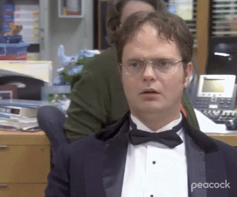 The Office gif. We zoom in on a stunned Rainn Wilson as Dwight in a tuxedo. Dwight's blank expression does not change as he speaks. Text, "Oh my god." The Office gif. We zoom in on a stunned Rainn Wilson as Dwight in a tuxedo. Dwight's blank expression does not change as he speaks. Text, "Oh my god."