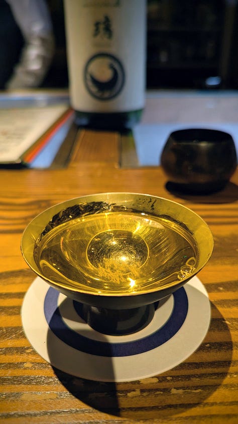 Japanese-style rooms, bowls of food, and bottles of sake.