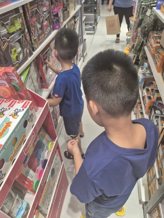 two little boys choosing toys