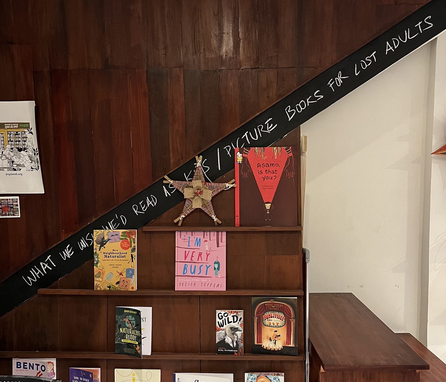 Handwritten banner and bookshelf inside Printed Matter bookshop in Fort Kochi Handwritten banner and bookshelf inside Printed Matter bookshop in Fort Kochi