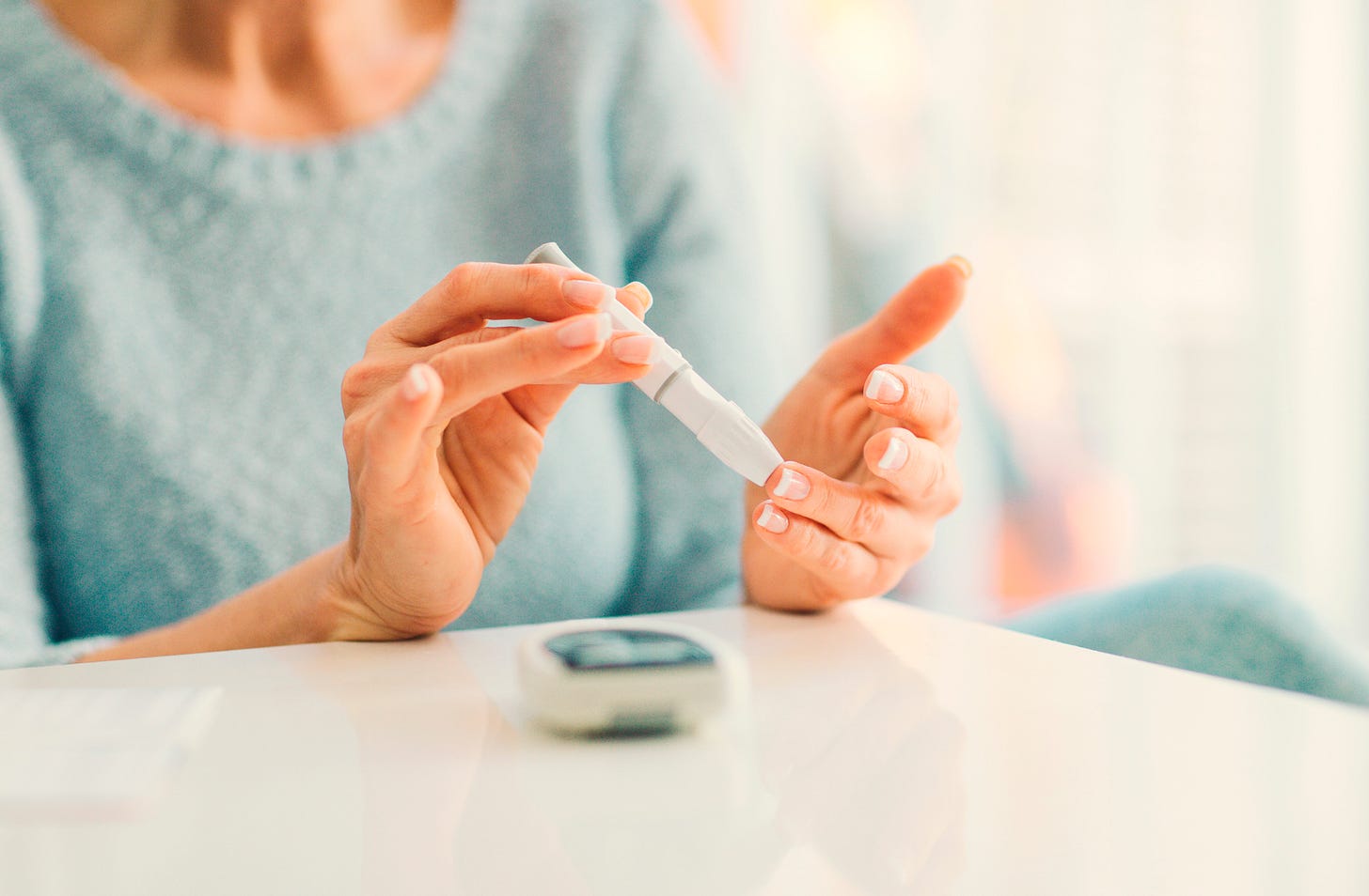 Testing blood glucose with a finger prick