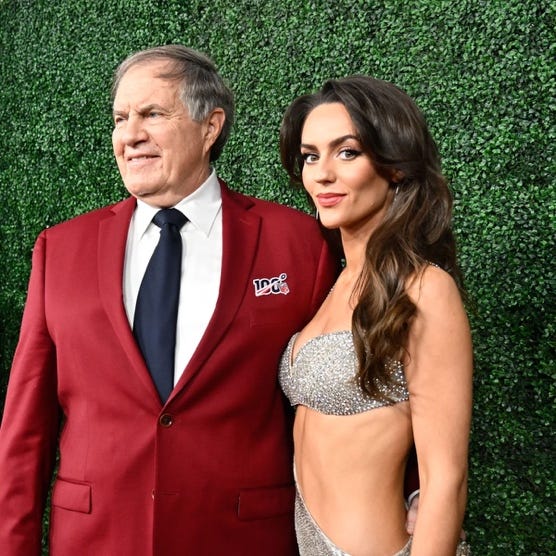 A person and person posing for a picture

AI-generated content may be incorrect.