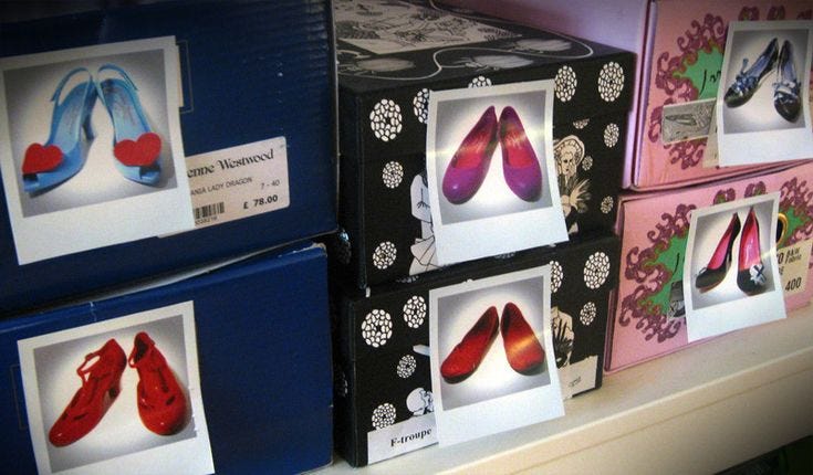 This may contain: there are several boxes that have pictures on them and some shoes in the bottom one This may contain: there are several boxes that have pictures on them and some shoes in the bottom one