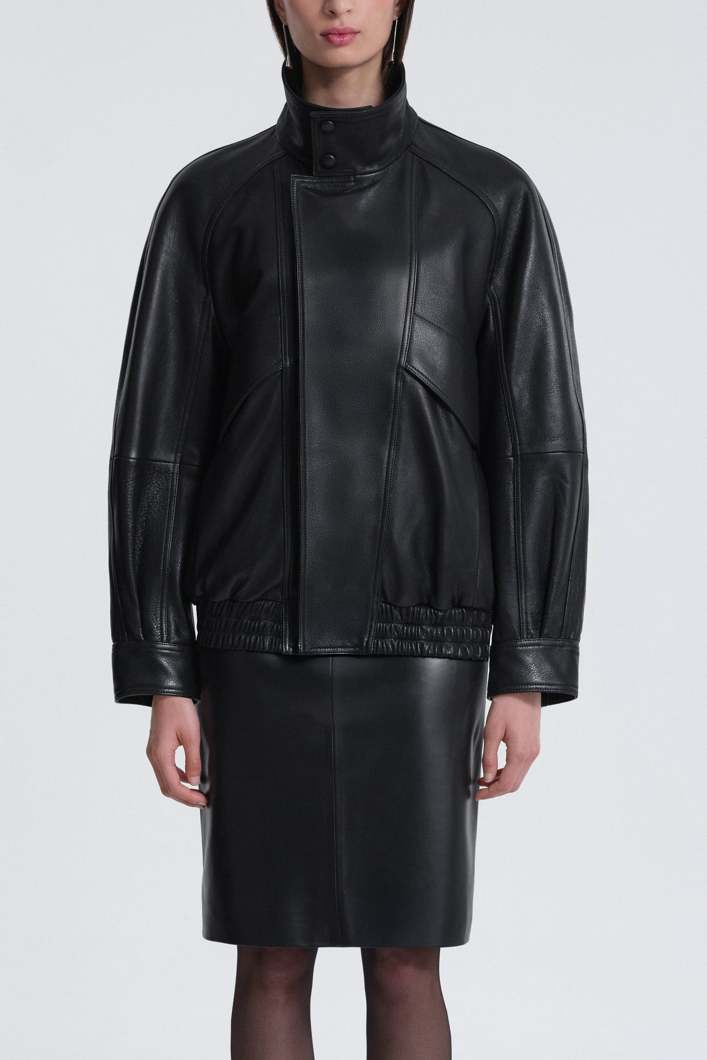 Model is wearing Nour Hammour Ariste Fluid Leather Jacket Black - Front