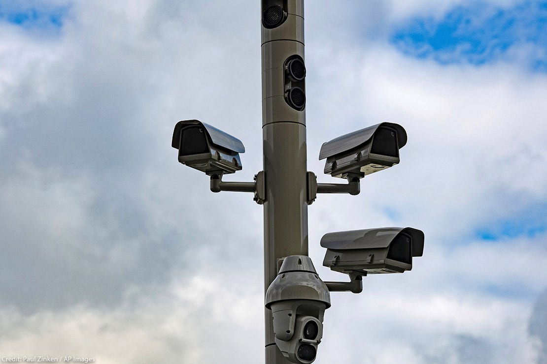 a utility pole with multiple cameras attached a utility pole with multiple cameras attached
