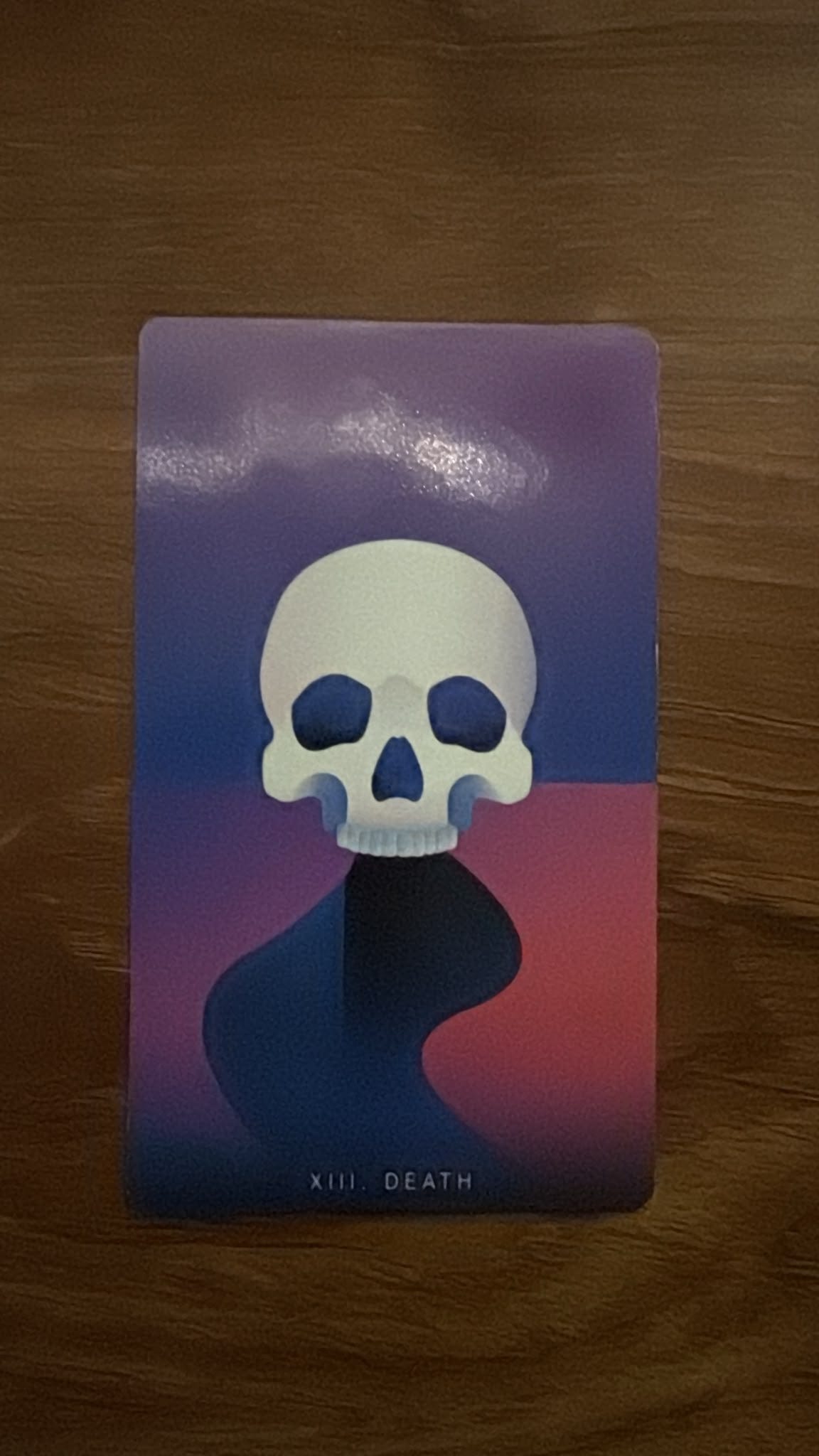 The Death card drawn during Boo Miller’s Tarot DMs interview, featuring a white skull against a purple and pink background. The Death card drawn during Boo Miller’s Tarot DMs interview, featuring a white skull against a purple and pink background.