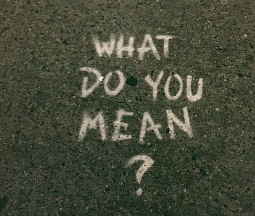what do you mean? text on gray surface