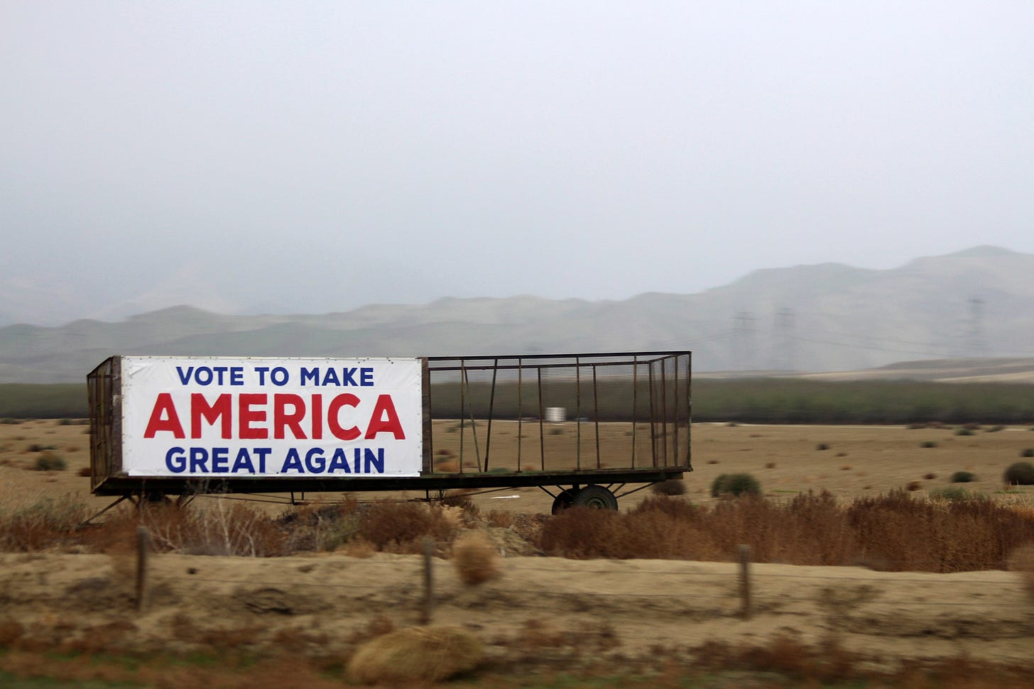 sign in California scrub saying "vote to make america great again" sign in California scrub saying "vote to make america great again"