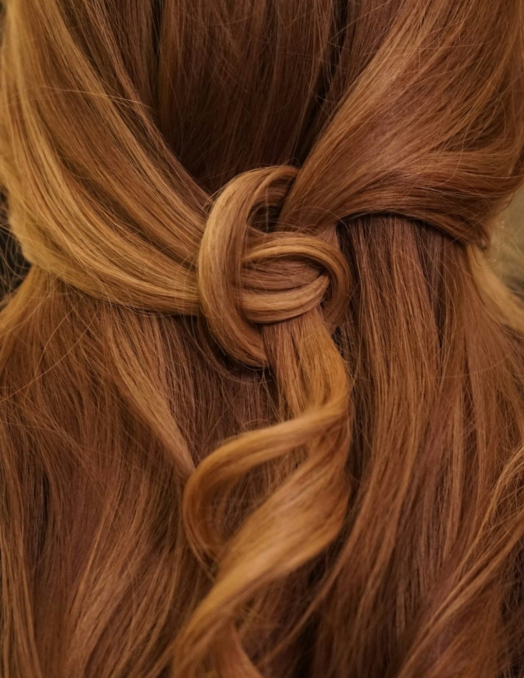 brown hair on white textile brown hair on white textile